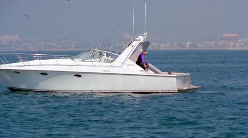 THAT'S STRANGE, IT'S THEIR BOAT, BUT I DON'T SEE THEM