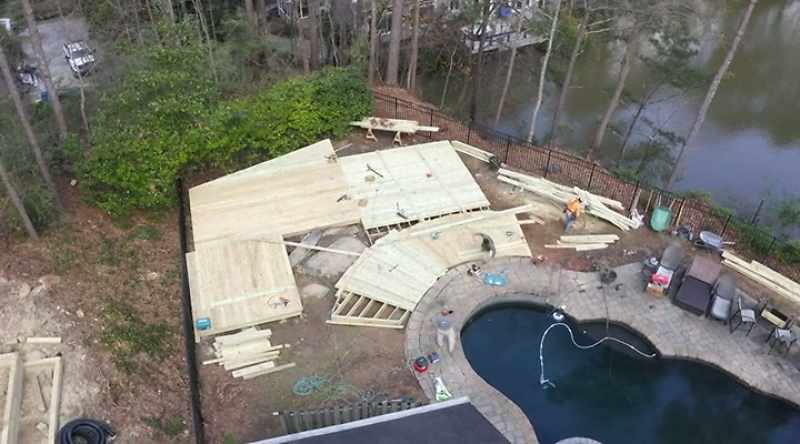 The 2,000 square foot deck around the pool is down