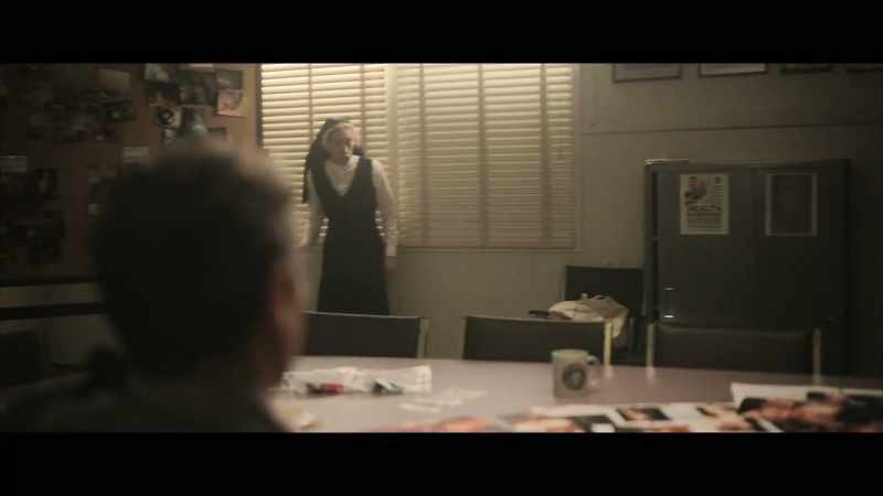 The arm, another clue, a lily