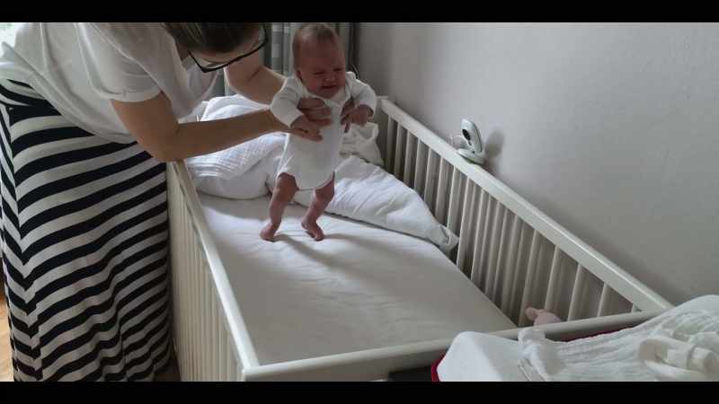 The baby moves its legs alternately