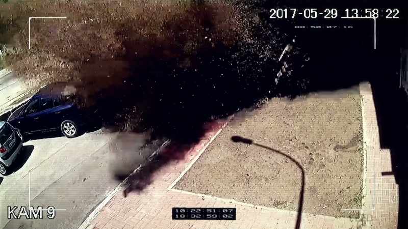 THE BLAST TEARS APART THE PARKING LOT