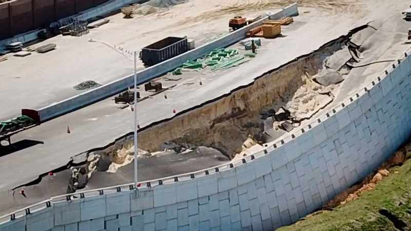 The eroded embankment collapsed like a landslide