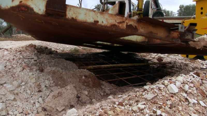 The extracted dirt is sifted through and searched for precious black opal