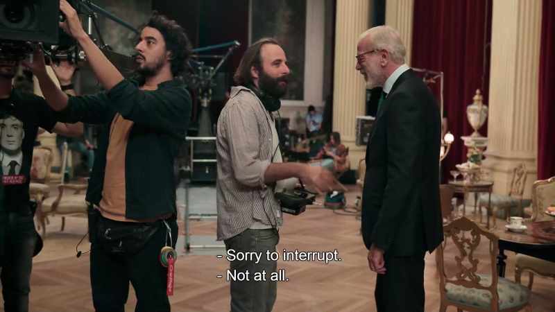 The extras are getting ready. -Are you happy with the shoot?
