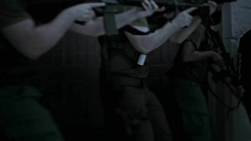 The first man goes to the front door, and inserts what we call flash-bangs
