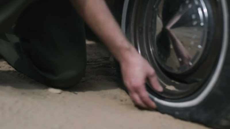 The flat tire didn't look right to him