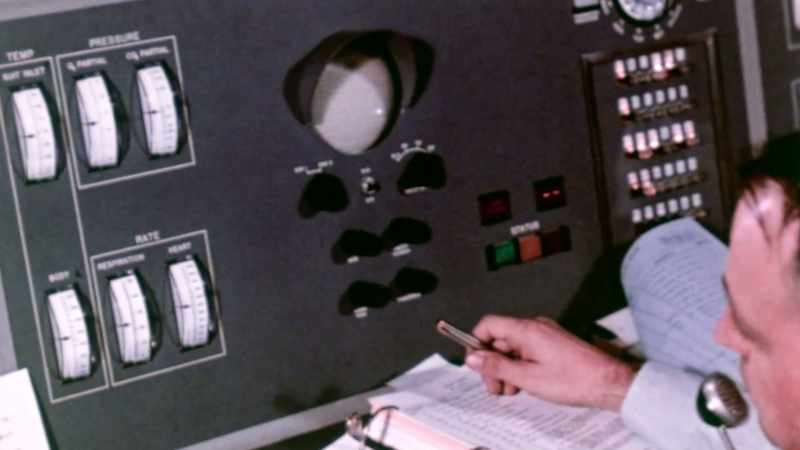 The Flight Surgeon watches the monitors