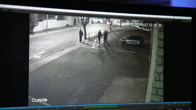 The four individuals are walking towards the camera