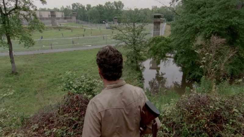 The group finds a prison overrun by walkers