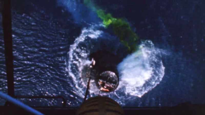 The helicopter is holding up the capsule itself