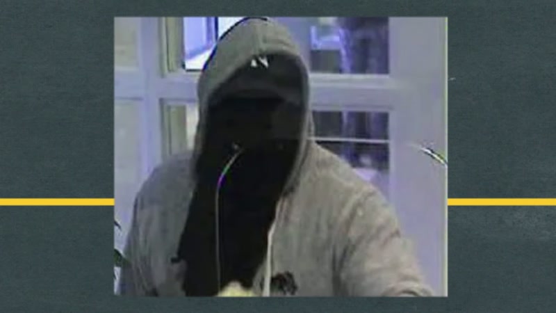 The hood was up, black mask covering his face