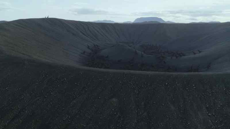 The huge crater, a caldera, provides a safe communal nesting ground