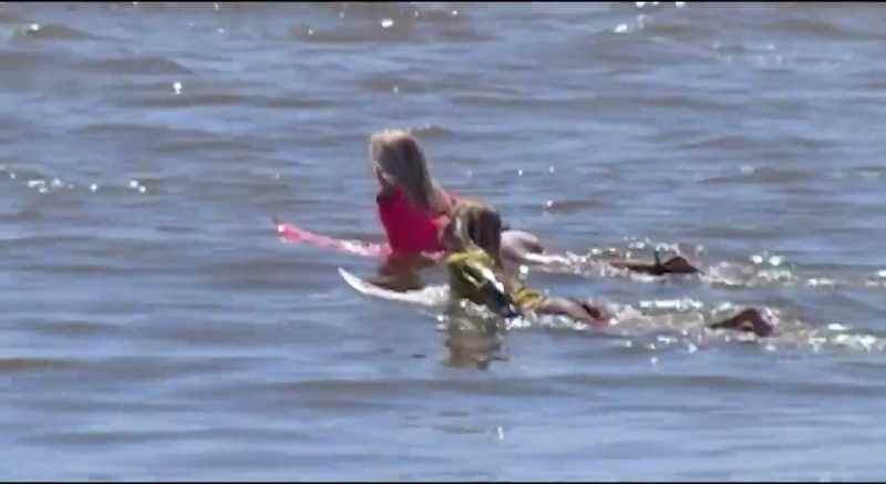 The moment she paddled out