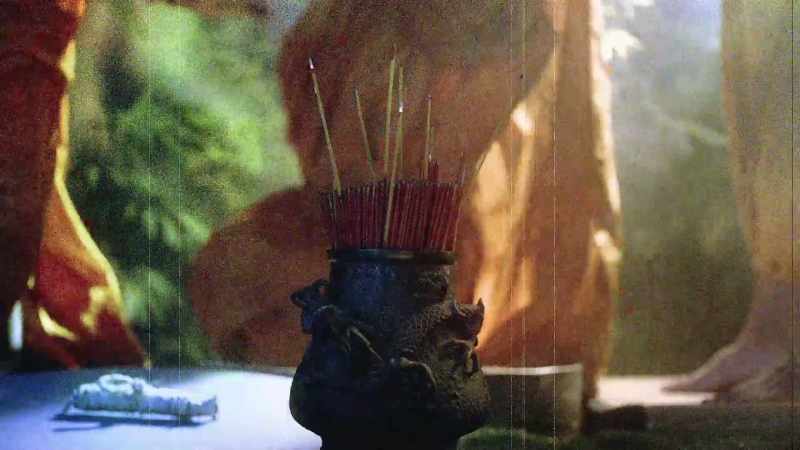 The monk is put into a small pine box