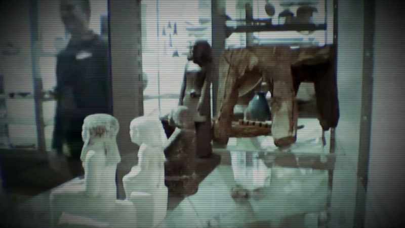 THE MUSEUM STAFF ATTACH A RUBBER MEMBRANE TO THE STATUE'S BASE