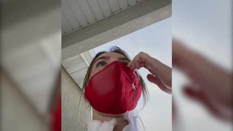 �The neighbor peeks through a small window