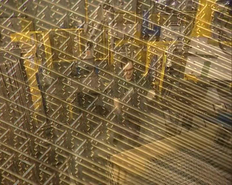 THE NEXT MACHINE APPLIES 20 TONS OF PRESSURE