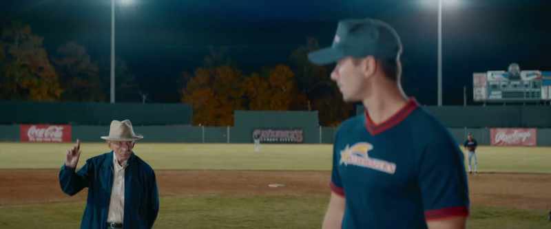 The pitcher gets back on the rubber, looks back