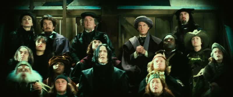 The players take their positions......as Madam Hooch steps onto the field to begin the game!