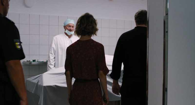 The policeman took a step back when the pathologist pulled back the sheet