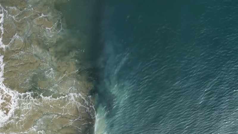 The rolling surf conceals life-threatening dangers