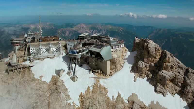 The snow in the mountains retreats