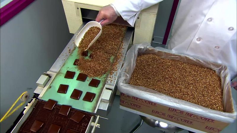 THE SQUARES MOVE ON TO ANOTHER REFRIGERATED BELT