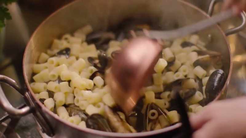 The starch from the pasta water thickens the liquid