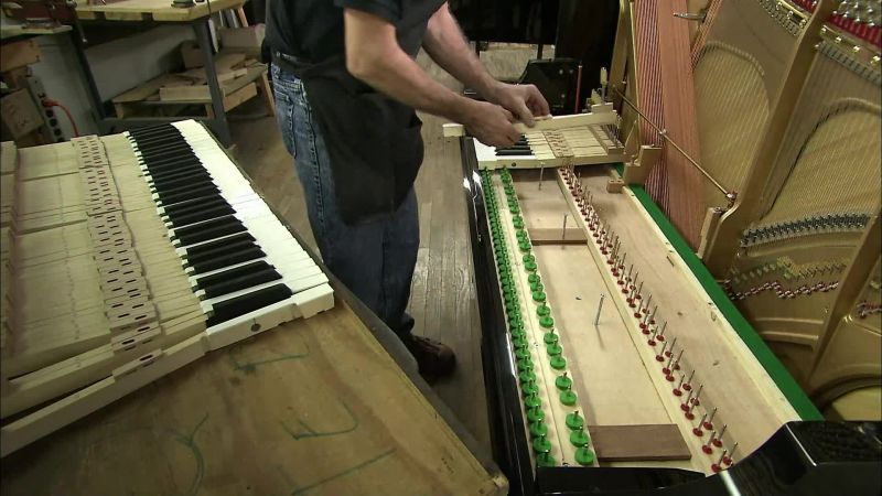 THE TECHNICIAN ASSEMBLES THE KEYBOARD