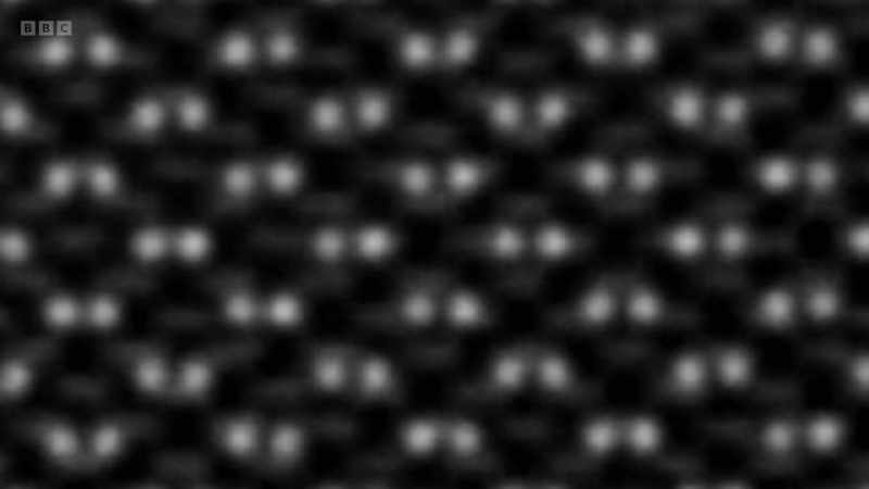 The white blurs resolve into two clear dots
