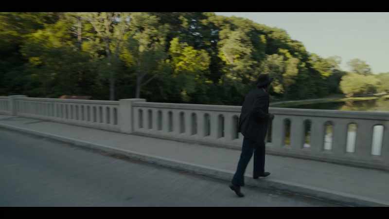 Then pushes her over the guardrail