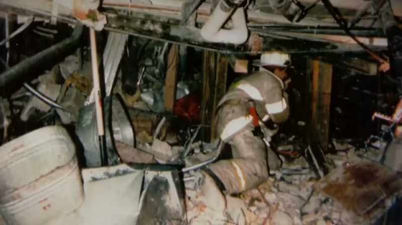 There was a first responder with his hand on the beam