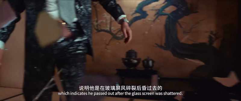There's splintered glass beneath him