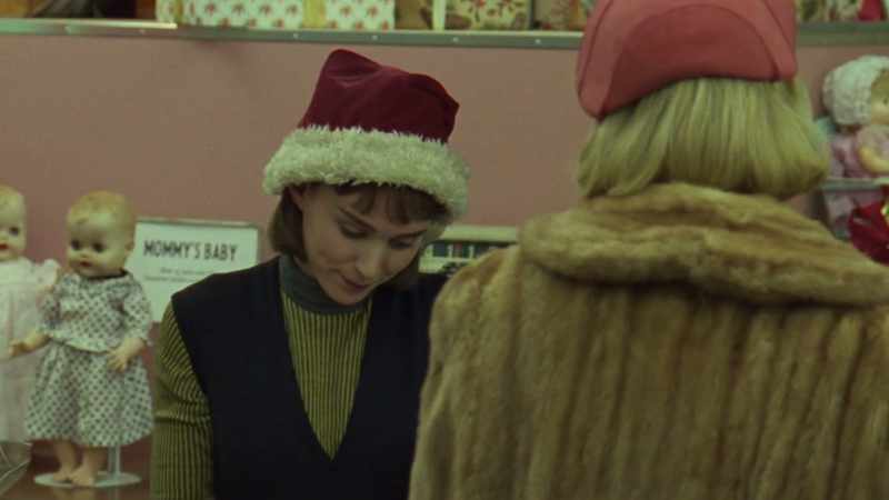 Therese noticed the woman's perfume, for the first time