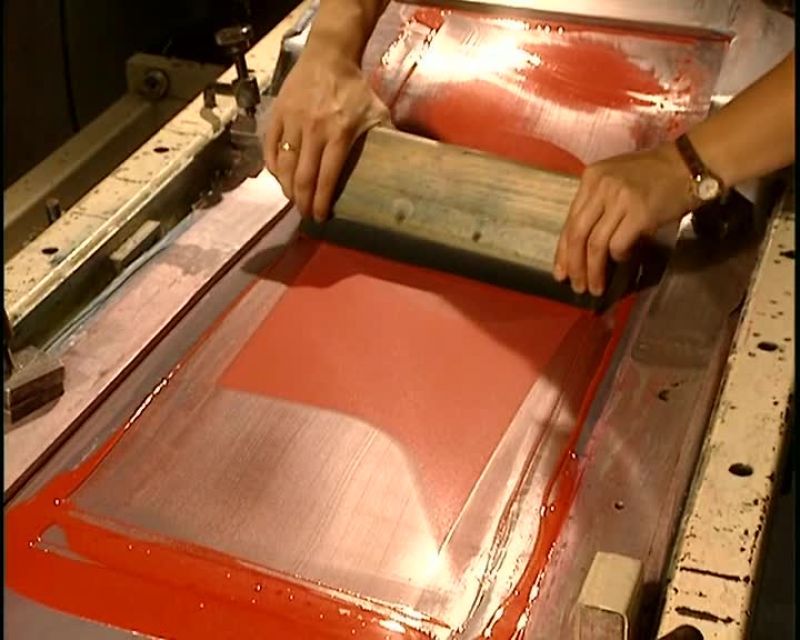 THEY APPLY, AGAIN BY SILK-SCREENING, ANOTHER COAT