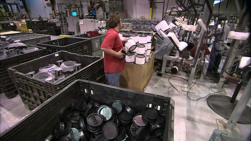 THEY LOAD THE VACUUM'S LID
