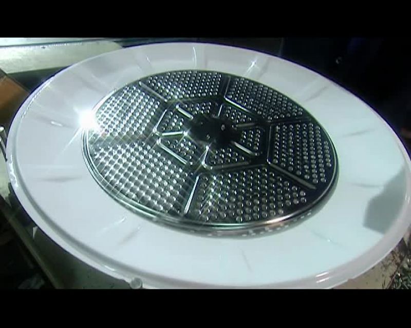 THEY MANUALLY ASSEMBLE THE DRUM'S BACK PANEL
