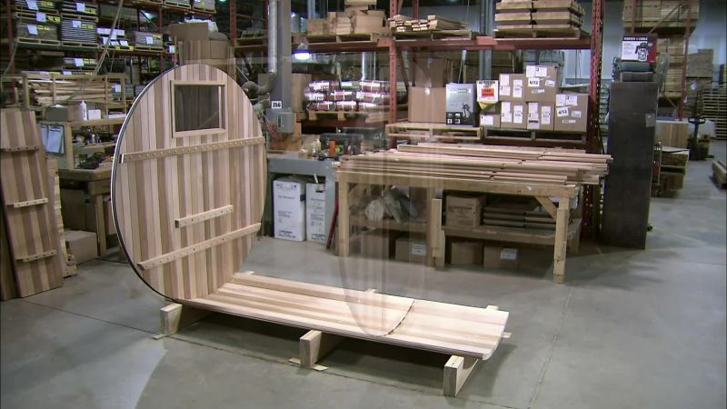 THEY MOUNT THE FRONT AND BACK WALLS ONTO THE BOTTOM SECTION