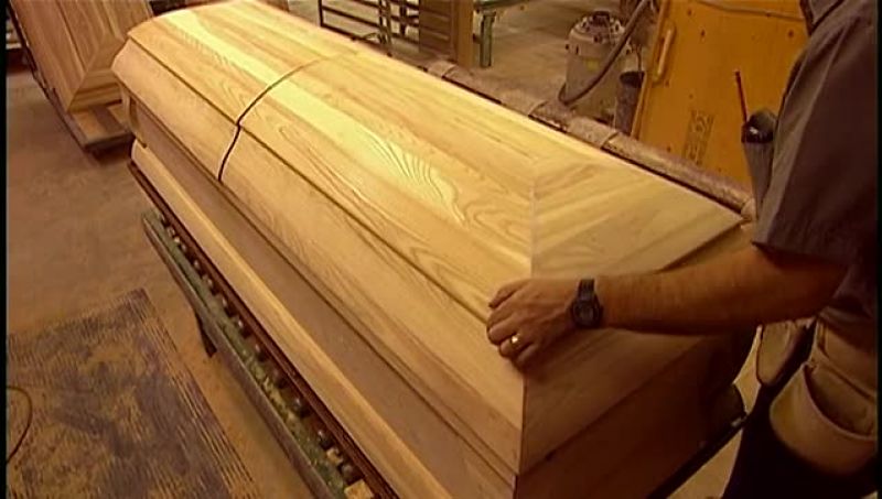 THEY SPRAY THE CASKET