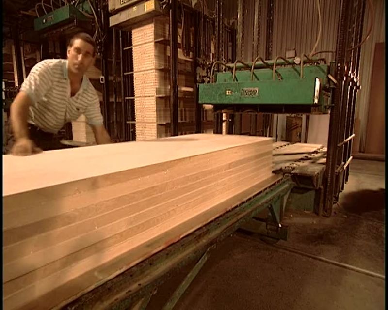 THEY STACK A FEW DOORS AT A TIME INTO A COLD PRESS