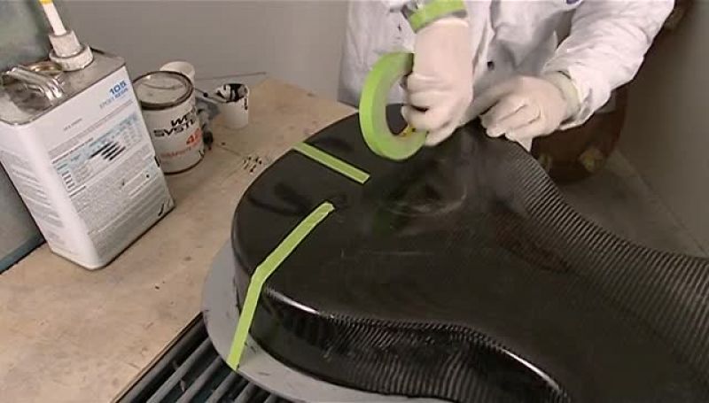 THEY TAPE THE BACK TIGHTLY IN PLACE WHILE IT HARDENS