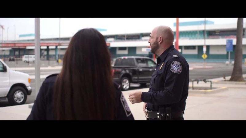 They're the Customs agents. I'm guessing it's shift change