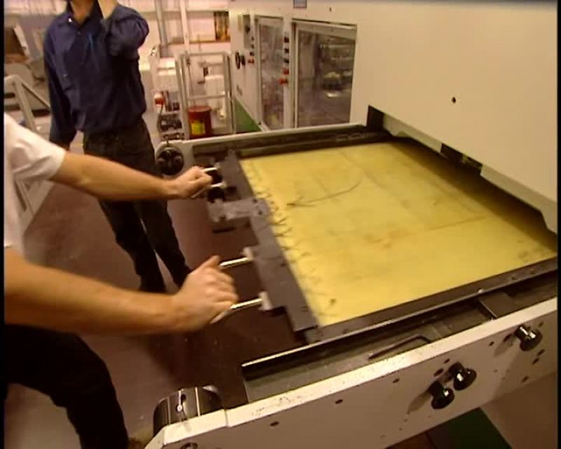 THIS SHEET IS SLID BEHIND THE CUTTING DIE