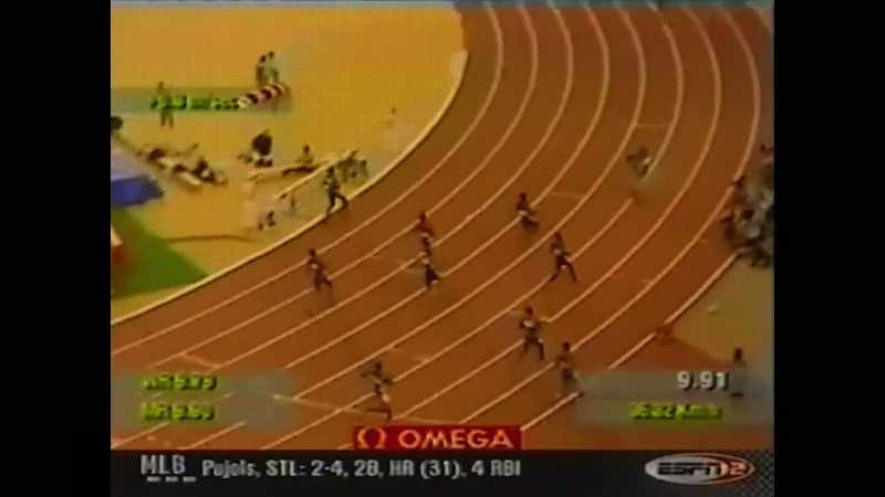 Tim Montgomery pulling away from everybody with 9.91 seconds