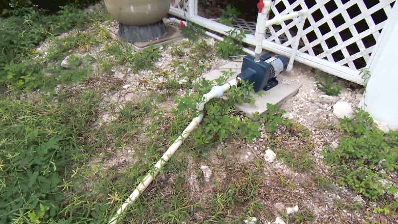 Tim has taken the old pump from the pool system