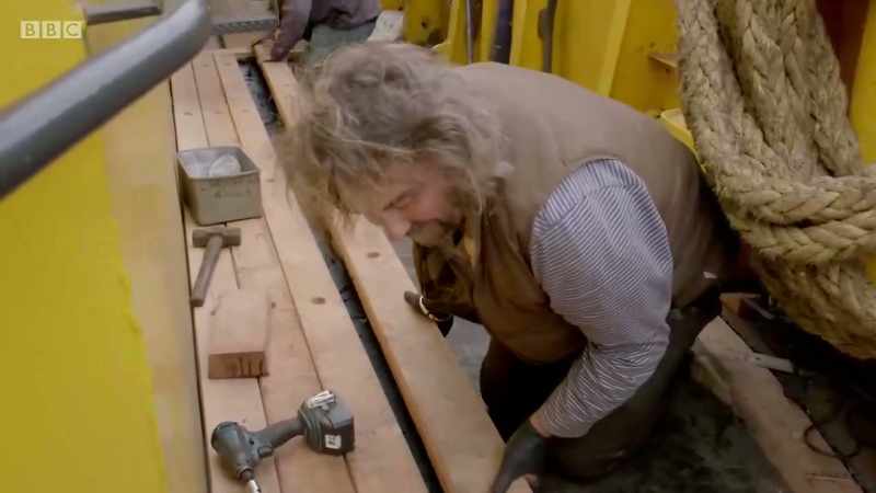 Today, he's helping replace a deck on an ageing trawler in Newlyn