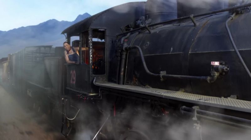 (Train chugging, steam hissing)