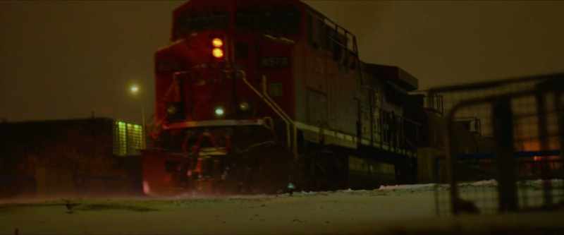 [train horn honking, phone ringing]