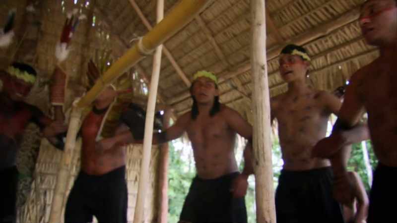 (tribe members chanting)