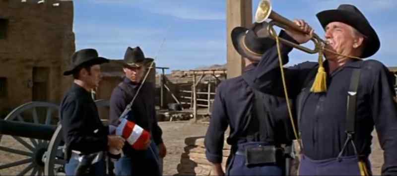 [ Trumpet plays reveille ]